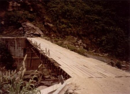 We crossed this bridge in a bus 2 times every week.  Scary!  I believe they later constructed a new bridge.
Jon W Tuckett
06 Jan 2004