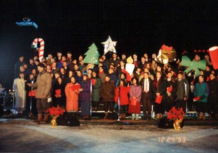 This is another shot of the Christmas sing, but from a slightly different angle so you can see more/different people than you can in the other shot that's already posted that looks similar. I believe this was Dec 24, 1993. Almost all senkyoushi were invited to this televised Christmas Carole except those who lived further than an hour (?) train ride from Sapporo. At this time, there were about 160 missionaries in the mission under Pres Ned Christensen. So you can guess about how many missionaries lived in and around Sapporo vs those who lived out on the island somewhere else.
Jim Dillon
11 Feb 2005