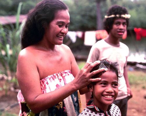 This is the wife of Walter Simram and two of their children at the chapel in Kolonia.
David  Johnson
01 May 2004