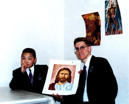 This picture is with Tegshjargal (Tegshee) from the old Selbe Branch.  He painted the picture of Jesus and gave it to me as a present.  The pictures of Captain Moroni and Samuel the Lamanite in the background are also his.
Carl Michael Sticht
19 Jan 2002