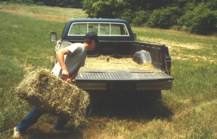 Here Elder Craig Peterson bucks some hay for a ward member.  Notice that there is no one in the vehicle.  In order to get the work done faster we put the truck in 4X4 low, put it in 1st gear and then we would both get out and throw on the hay.  It worked excellent until Brother McCalvain saw us.  He didn't like the idea as much as we did.
Travis Melvin Heaton
11 May 2005
