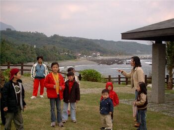 These kids were pretty surprised to see an Adoga snapping photos of them...I spent Christmas Day riding along the east coast on a rental scooter.  This was taken along the way, at a small park near the town of Donghe.
Adam  Hislop
07 Jan 2004