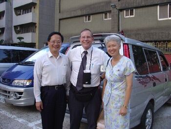 Elder Philip and Sister Maggie Ho with George Nielsen, taken 29 July 2004.  He called me his 