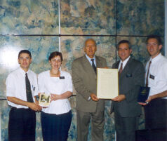 President e Sister Casado dando O Prefeito(Mayor) de Goinaia o Livro de Mormon, com os Elders Walker e Melo.  Esse foto foi na Aug 2000 Liahona
Spencer  Walker
11 Sep 2003