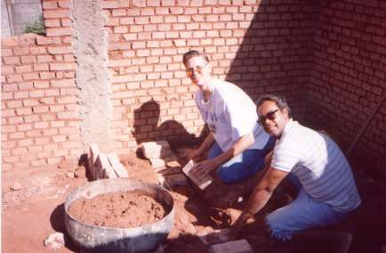 You can see how most houses are built. This is the basement of the home, so Celio is using solid bricks to be able to add a 2nd floor later. New neighborhoods start with dirt roads and homes with dirt floors and evolve to middle-class housing.
Daniel Gibby
18 Aug 2001
