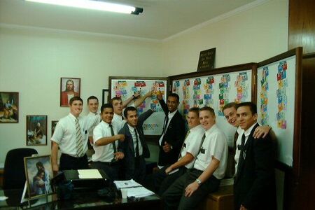 New Missionaries and their trainers pointing to their areas.  Elders: Bond, Killpack, A Santos, Conner, Santos, Florentino, Dow, Bleazard, Barnett, Travares
Richard S. Bangerter
03 Aug 2003