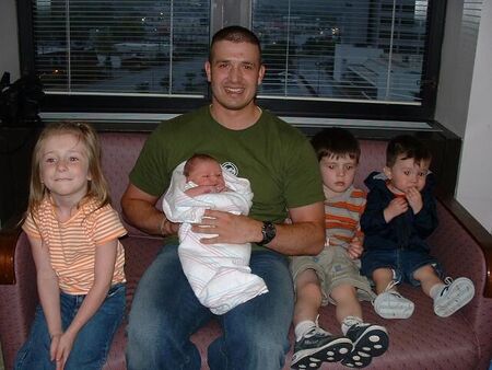 This photo was taken a few hours after the birth of our fourth child on 10 April 2003.  From left to right: Alexandria, Dad and baby Wyatt, Shea, and Skyler.
Wesley Dean Carlson
24 Apr 2003