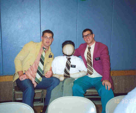 Elder Walters and Elder Clark sit by their missionary buddy during a costume for the Hialeah Ward.
Derek Hernandez
09 Nov 2002