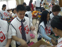 Elder Siu Ming Ng, from the Netherlands, assists other missionaries and members from the Jakarta District in assembling the 3000 personal hygiene kits.
Ralph R. Zobell
05 Jan 2005