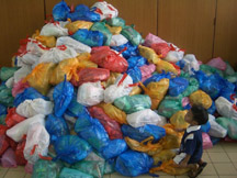 An Indonesian primary boy is amazed by the mountain of bags that are ready for shipment. (Photo courtesy President Dean C. Jensen)
Ralph R. Zobell
05 Jan 2005