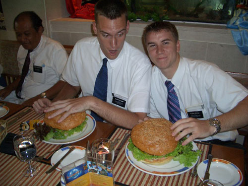 Courtesy of President Jensen.  Elders Stoker and Gevas eating the monsterburger contest at the local Novotel in Solo.  If they eat it in less than 30 minutes, the hamburger is free.  Elders Stoker and Sakievich did it in 13 minutes.  Elders Hoehn and Gevas finished in 25 minutes.  The hotel said only 2 people out of 144 had accomplished the task during the prior month.
David Brewer
26 May 2005
