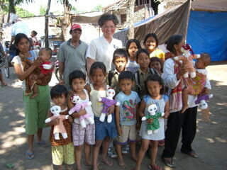 Handing out dolls to the local children
David Brewer
11 Jun 2006