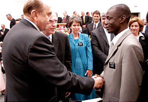 President Thomas S. Monson greets President Norbert Ounleau, 35, of the Ivory Coast Abidjan Mission, the youngest president attending the annual training seminar.
Korey Payne
07 Jul 2005