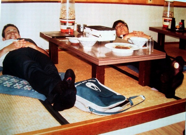 (L to R) A Special P-Day in the Lives of Two Missionaries: Just before transfers the night of Monday, 18 July 1977, Elders Van Bagley and John Abe rest after a sumptuous meal of 