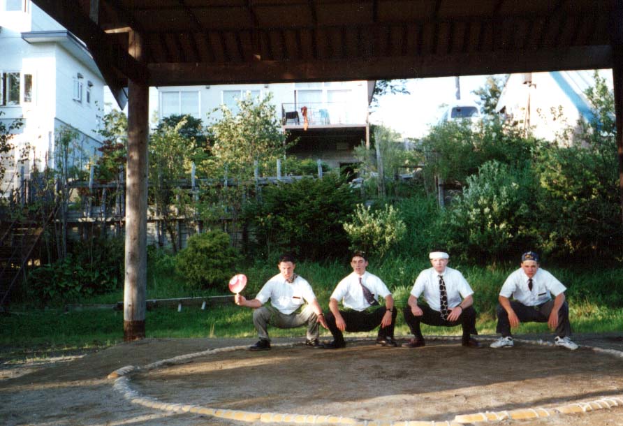 August of 1993, the 4nin apato tried their hand at some real sumo. This was Pday at a park up on Midoriaoka hill on the East side of Kushiro. From left: Dillon, Watts, Atkinson, McBride. I can't remember if McBride or Watts won the double-elimination tournament.
Jim Dillon
11 Feb 2005