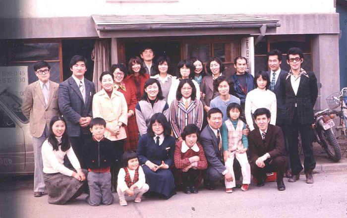 March 1975 Hachinohe Branch photo taken just after Sunday church meetings in front of the church / elders quarters at Kamikazushi-chou 15, just a few weeks before we moved to the new rented building at Numadate 1-2-20.<br>
Front row from left:  Terasawa s, Kubota c., Endo c., ?, ?, Kubota b., Endo c., Endo b.<br>
2nd row-standing: ?, Sakamoto b., Harashima s., Kubota s., Harashima s., ? Endo s., ?<br>
Back row: ?, Harashima Aiichiro b., Ohno (Wakamatsu) s., ?, ?, ?, ?, Yoha b., ?
Todd Ogaard-Webmaster
29 Nov 2008