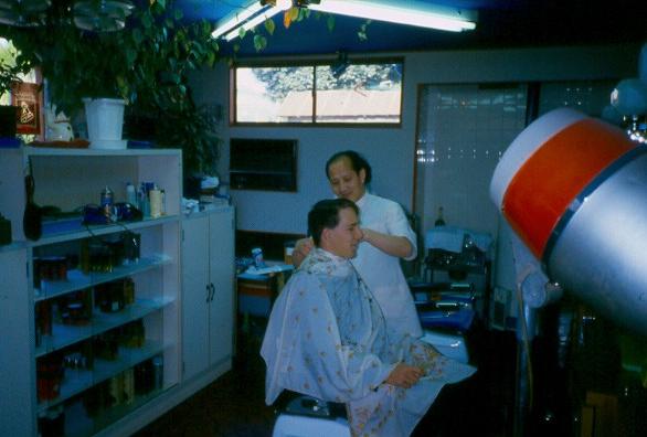 Japanese barbers enjoyed giving haircuts to foreign missionaries.  Here Elder Jensen gets a little off the top...and sides...and back...do you still have a missionary haircut?
David  van der Leek
18 Aug 2003