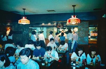 People filling their faces with all you can eat Shakee's pizza.  Will that be the squid or octupus pizza sir?
David  van der Leek
20 Aug 2003