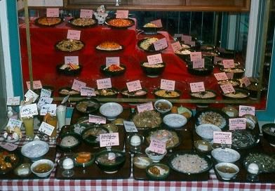Restaraunts and other eating places would display their menu with real looking food items made from what looked like plastic in the window.
David  van der Leek
18 Aug 2003