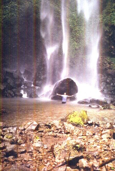 Mahagnao falls Burauen. 15 klms away from Burauen. Ride a truck going up thru rough road. after reaching a village with forested trees near the lake, hike up and down passing thru steepy hills full of huge trees and figs. reaching down huge creek from the falls. cross a river 4 ft. deep walking thru it, then a small creek full of green rocks and water bushes. All it needs on this place is a dinasour. walk for like 2 hours until we reach the Mahagnao falls.
Genesis San Juan Magat
26 Apr 2003