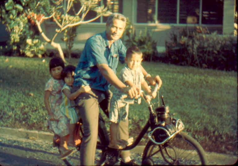 Picture of Ed Kamuoha (in 1967) and his kids on a Solex.  How many remember him?
Tommie  Matthews
31 Jan 2003