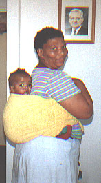 It was so amazing to me that with a simple towel, these african women can totally calm down their children AND do housework at the same time. Recognize the Apostle in the back ground? (not from our church!)
Megan  Rees
22 Oct 2001