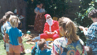 December... one of the hottest months of the year.  And there's Elder Adam Hansen filling in for Santa at a branch party (there's no way you'll find the jolly elf himself anywhere near South Africa in December).
Bill  Peavoy
31 Aug 2001