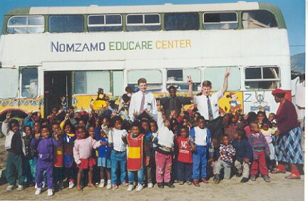 This was a small township school we took bread to up near Paarl.  The broken down old bus and the playground in front of it made up the entire campus.  Brings a whole new meaning to the term schoolbus.
Bill  Peavoy
29 Aug 2001