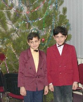 Ukranians celebrate New Years how we celebrate Christmas and then their Christmas is Jan 6th and is strictly religious, which is probably a good way to do it! These are two little guys from the Crimea, posing in front of the church's Charlie Brown Christmas Tree :)
Heather Hokanson
12 Nov 2003