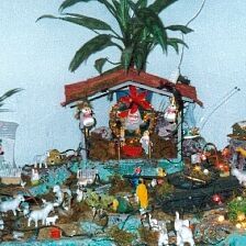 In Guarenas, it was very popular to decorate homes with these nativity scenes instead of Christmas trees.  If you look closely, you might see that this one has a tank protecting the Christ child.  One of the members of this family served in the military.
Erin Elizabeth Howarth
09 Nov 2001