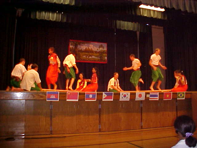 August 2001  -------Asian Cultural Night------
Those four Viet Elder...  ...like to burn their tongue.  Look like they stick dance too good.
Christopher A. Johnson
04 Mar 2002