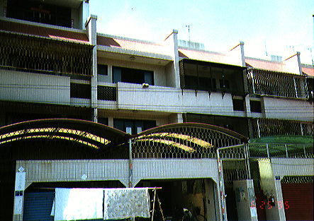 Our apartment in Tainan, on Dong Men Lu.  Ours is the one with the open garage door.
Chad 孫耀威 Snelson
30 Mar 2003